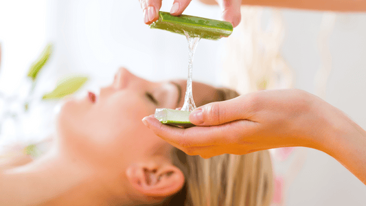 A minimalist, soft-toned image of natural skincare items (like a clay mask, body oil, and aloe vera) arranged on a beige cloth.