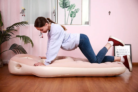 Pregnant woman sleeping peacefully with a maternity pillow.