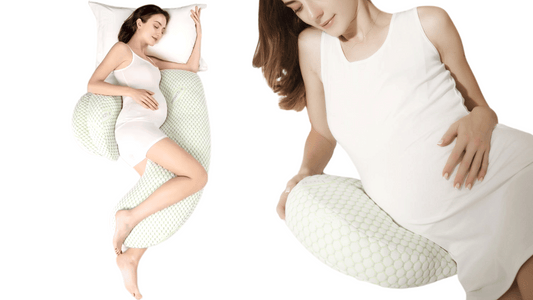 Happy pregnant woman relaxing with a maternity pillow.