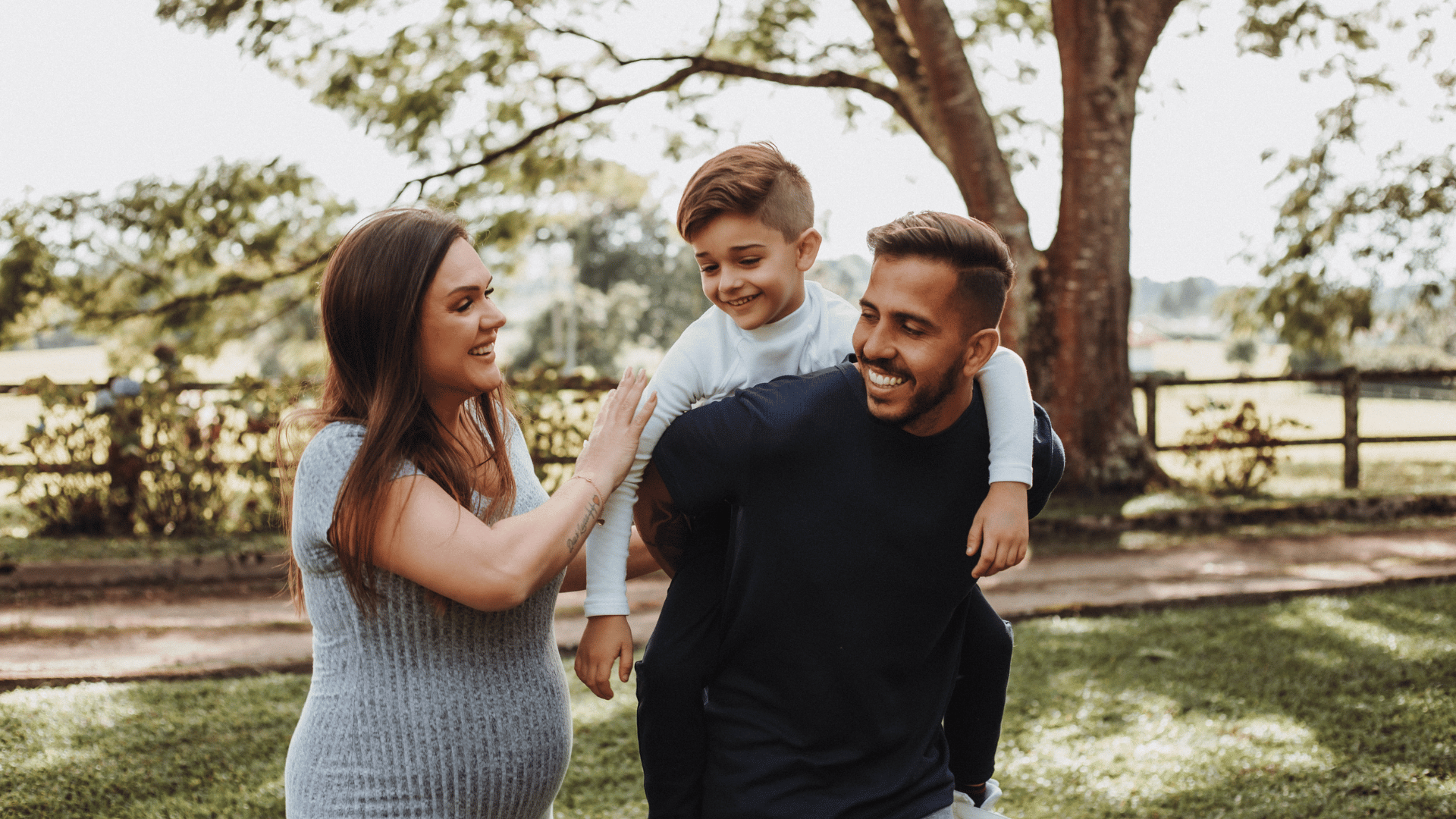 A pregnant mum in your leggings chasing a toddler at a UK park