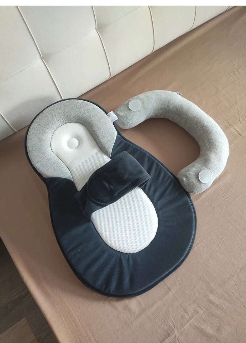 Gray and black reflux pillow on a double bed