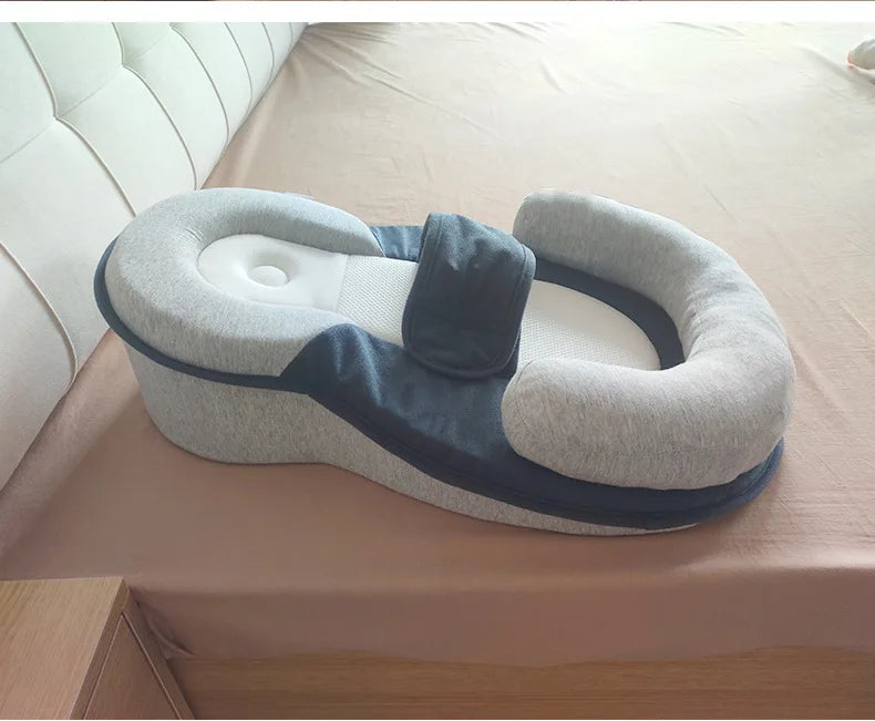 Gray and blue reflux pillow with a white couch in the background