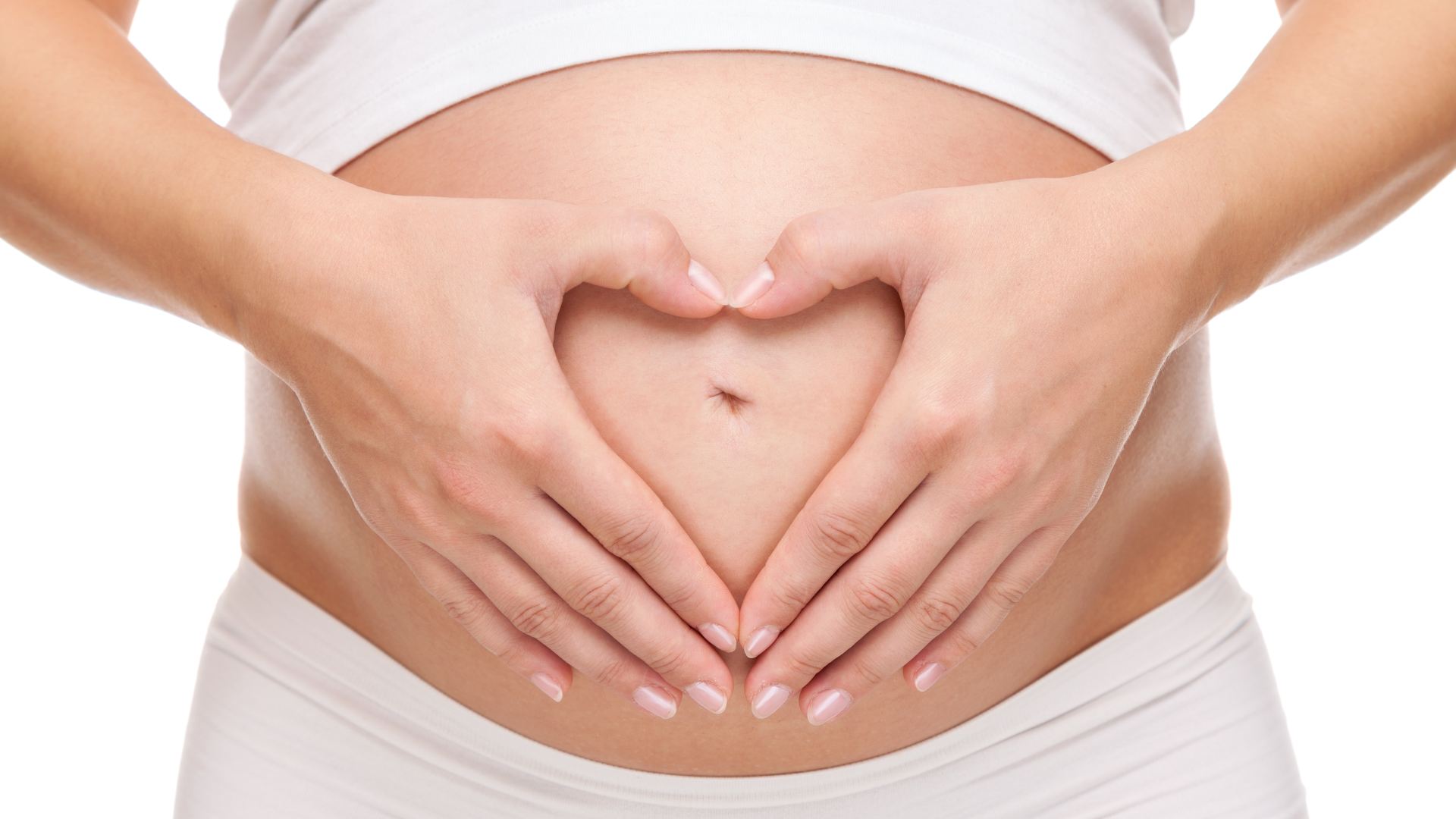 Image of a pregnant belly and a pair of hands shaped in a heart resting on her belly