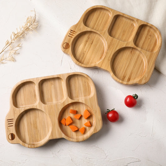 Two wooden divided trays on a light surface with vegetables.