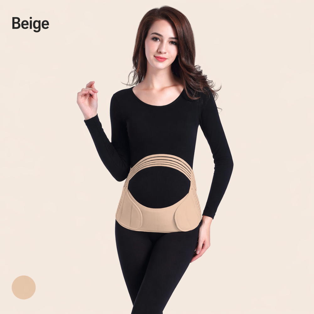 Woman wearing a beige Mama's Bump Essential Pregnancy Support Band over a black long-sleeve top and leggings.