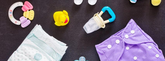 A selection of essential baby items like a stroller, car seat, and diaper bag, arranged neatly.