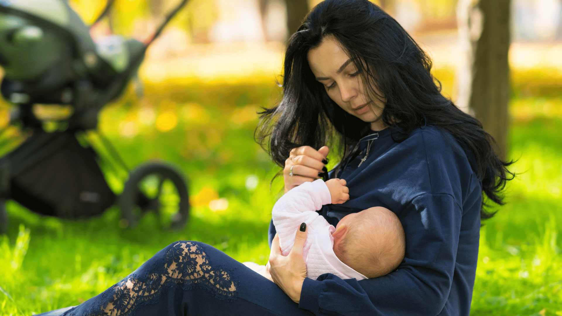 A mum breastfeeding in a UK park