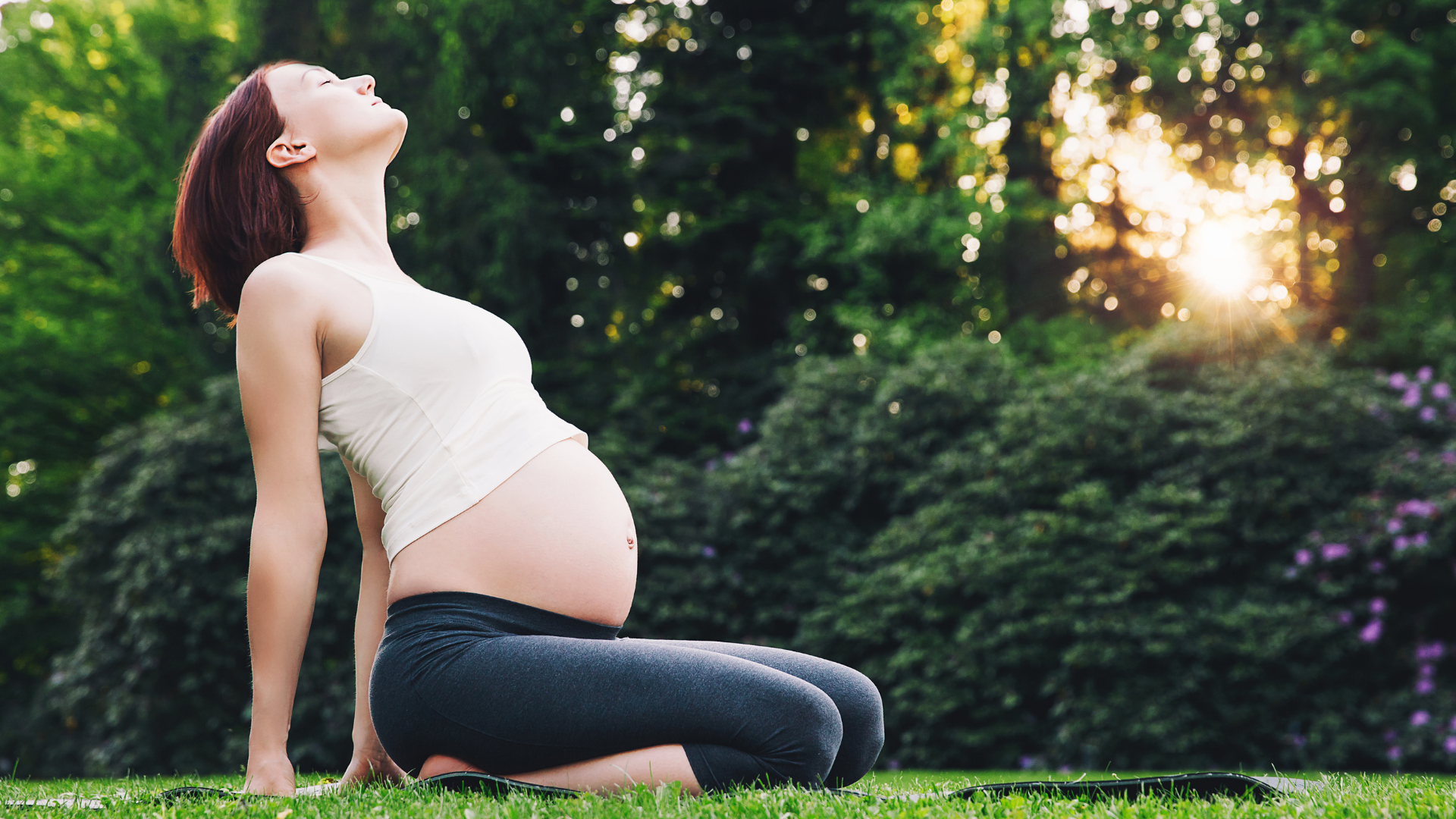 A serene pregnant woman practicing prenatal yoga