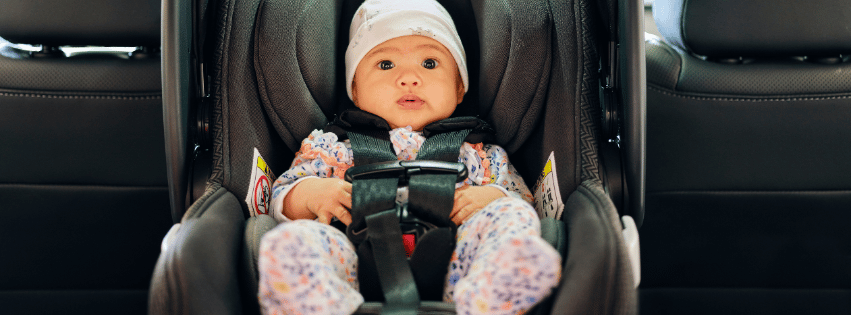 Baby securely sitting in a car seat