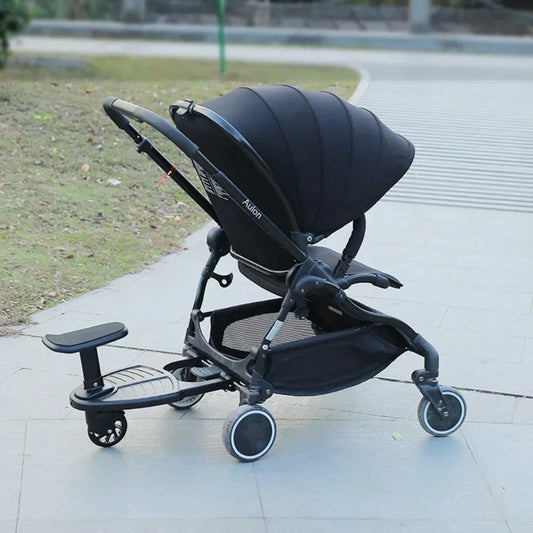 Baby stroller with a Pink Universal Stroller Step Board Adapter with Seat