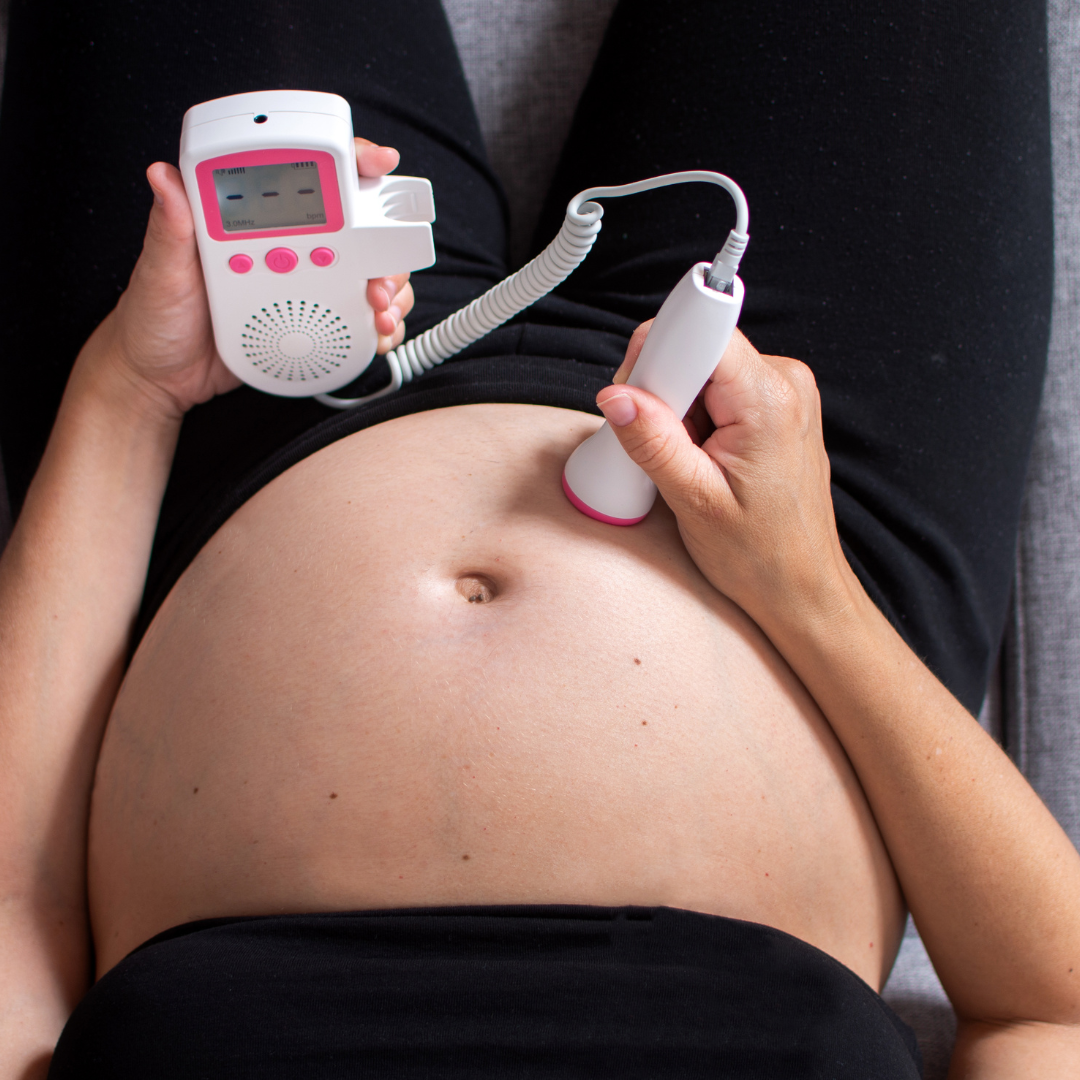 Pregnant woman using a fetal doppler for their first time