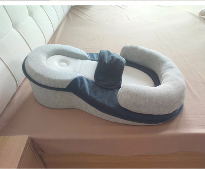 Gray and blue reflux pillow with a white couch in the background