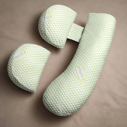 Green J-shaped maternity pillow