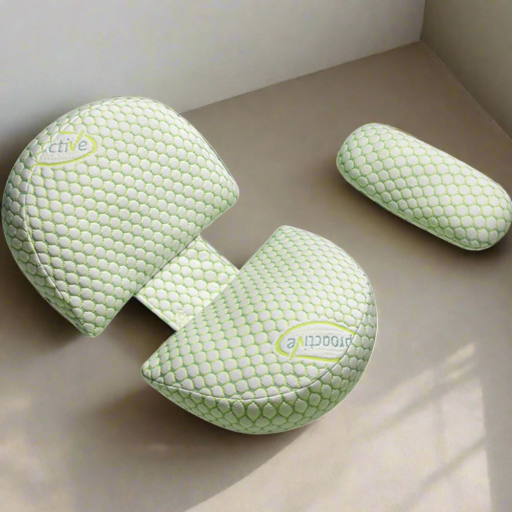 Green U-shaped maternity pillow