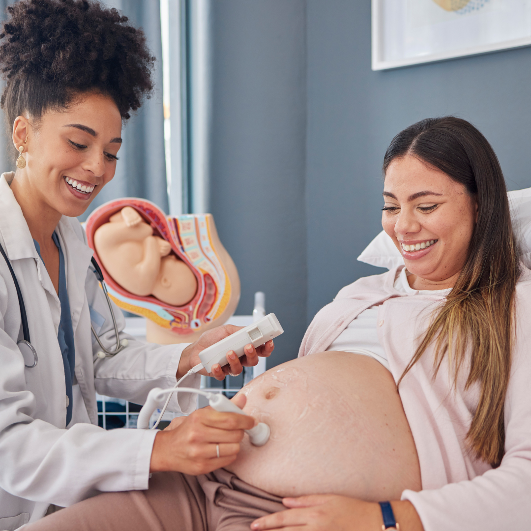 Midwife using the fetal doppler