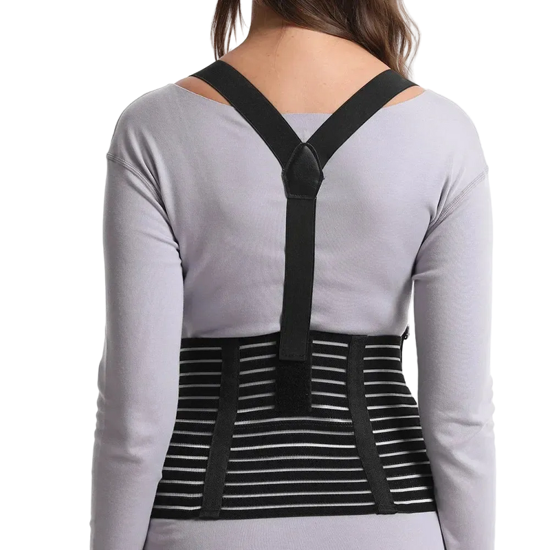 Person wearing a black posture corrector over a gray shirt on a white background