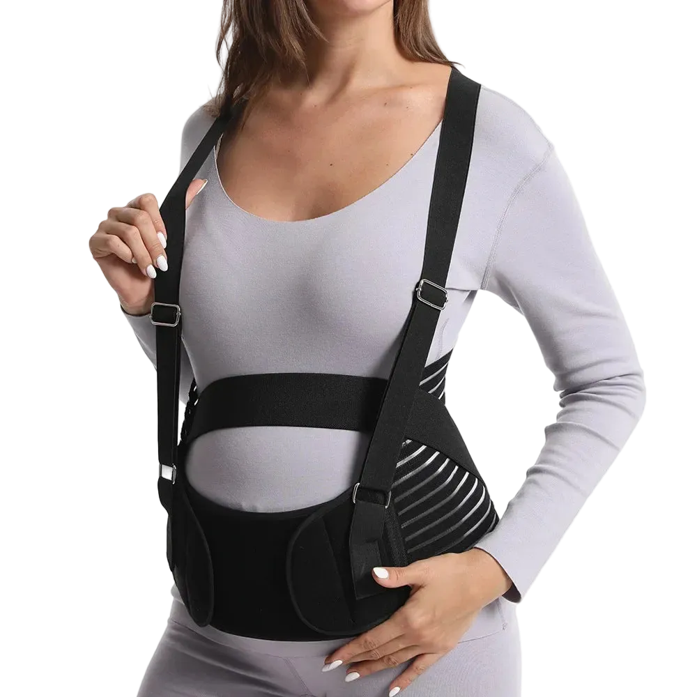 Person wearing a black shoulder brace against a white background