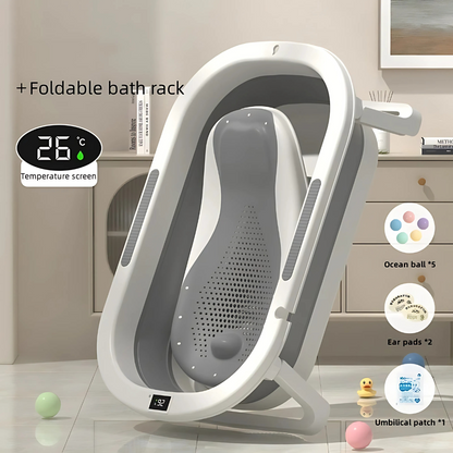 Foldable bath rack with temperature screen and additional items on a bathroom floor.