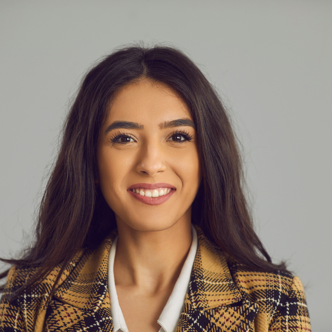 Woman headshot wearing a chequered shirt