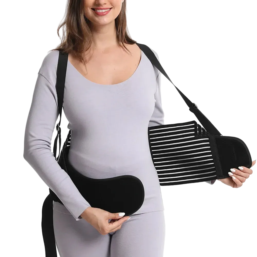 Woman wearing a black sling on one arm against a white background