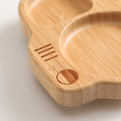 Wooden cutting board with a heart-shaped design on a light background