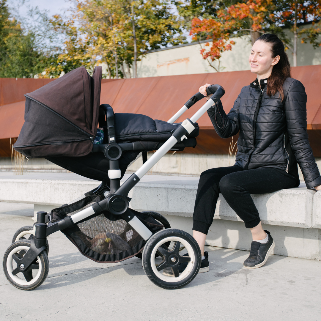 Pregnant woman using a pushchair